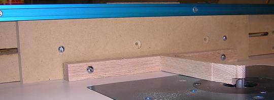 Binding jig attached to the router fence.