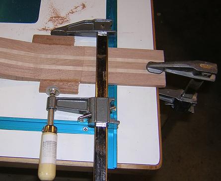 Gluing the ears to the headstock.