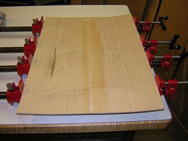 Gluing up the now warped maple top.