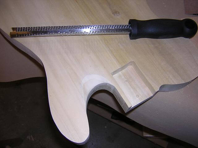 Carving the profile around the lower horn.