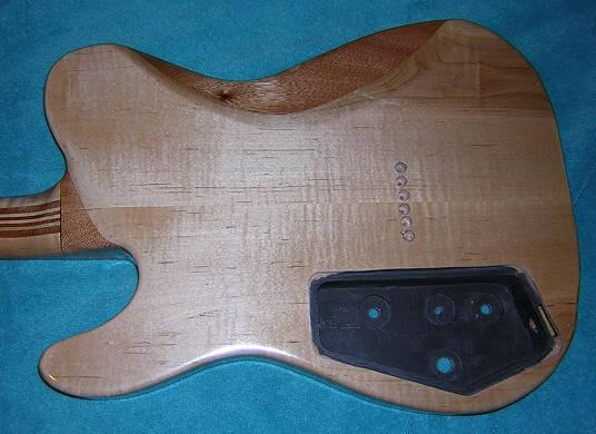 The final finish of the back of the guitar.