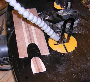 Cutting a truss-rod cover.