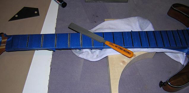 Recrowning the frets.