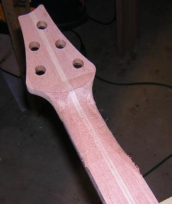 Beginning the neck carve with the volute at the headstock.