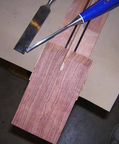 Cutting the truss rod adjustment channel.