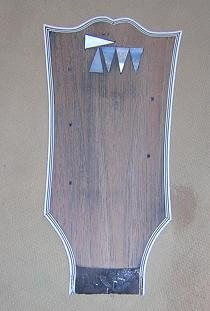 The headstock inlay sanded.