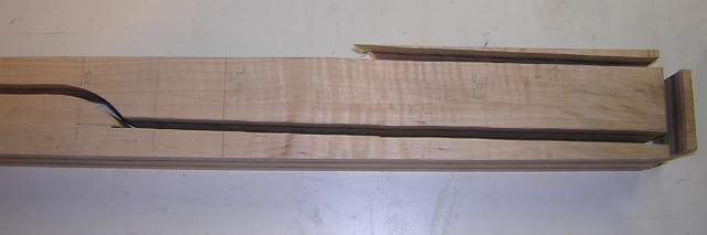 The body end of the neck blank cut to create the angle.