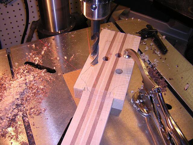 Drilling the tuning peg holes.