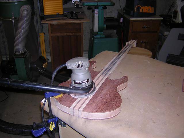 Sanding the body after gluing.