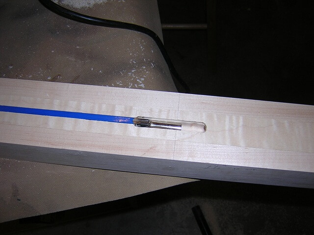 Widening the adjustment head area of the truss rod channel.
