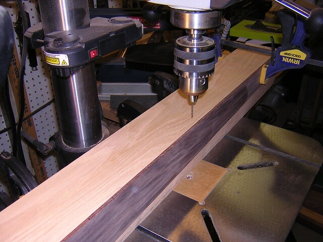 Drilling holes for the fretboard dots.