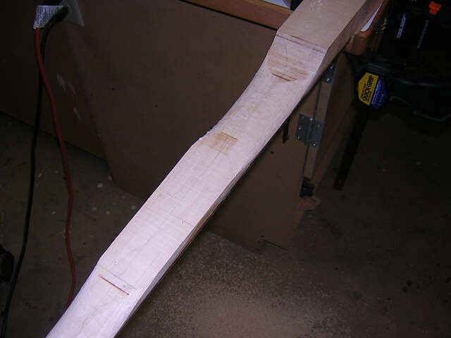 Carving the heel end of the neck.