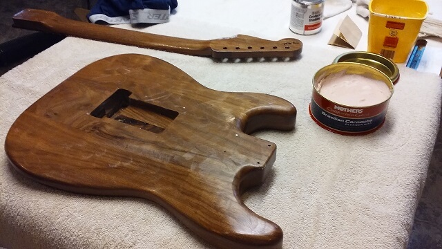 Putting a coat of wax on the instrument.