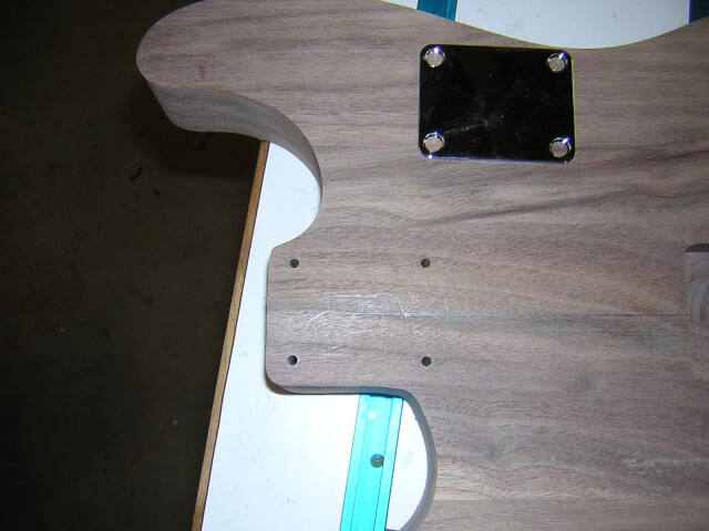 Drilling the holes for the neck bolts.