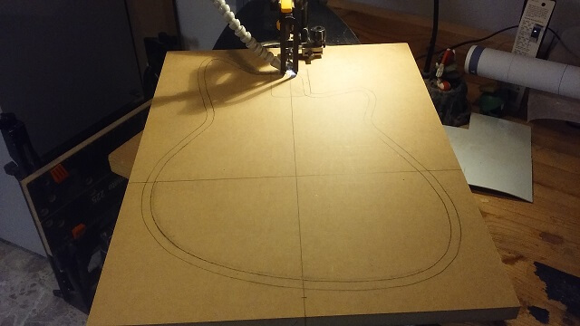 Cutting out the template at the scroll saw.