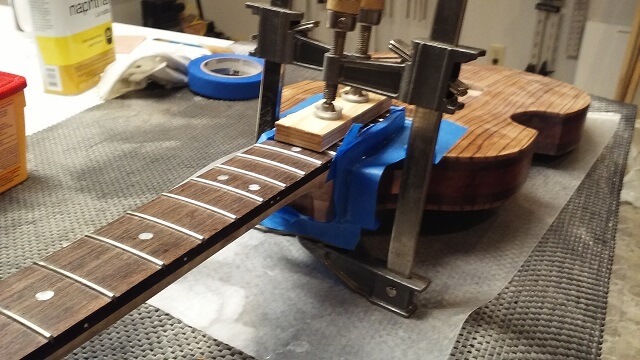 Another view of gluing the neck to the body.