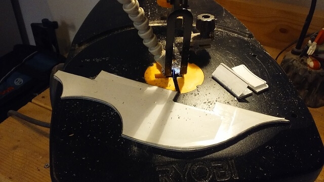 Cutting out the pickguard on the scroll saw.