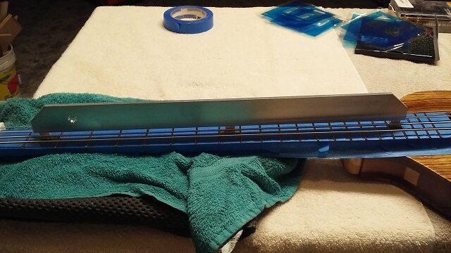 Straightening the neck while under string tension.
