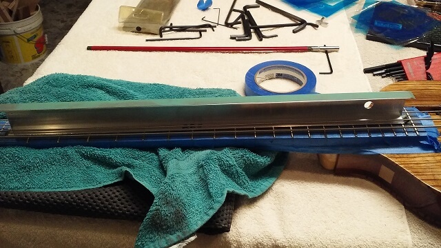 Leveling the frets.