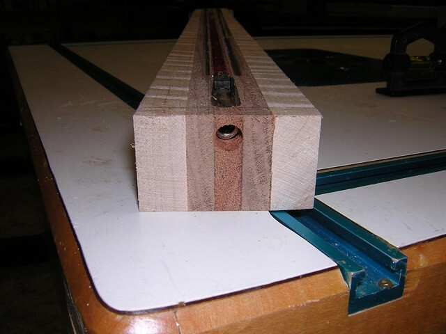 Drilling a hole for the truss rod adjustment.