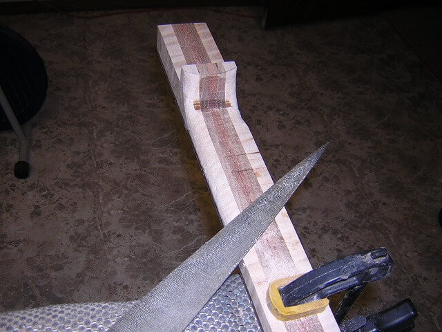 Beginning the neck carve with the heel.