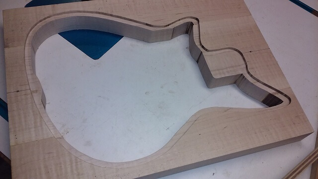 The rear of the instrument routed for the inlaid walnut back.