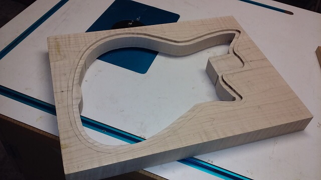 The front of the instrument routed for the inlaid walnut front.
