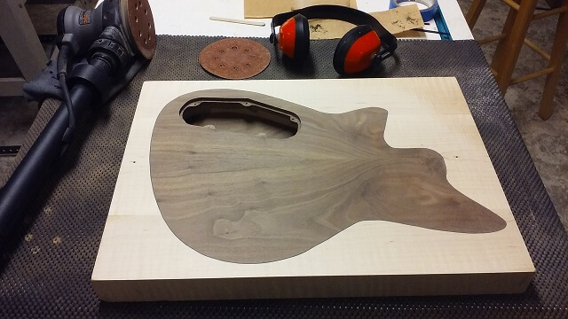 The back sanded flush with the maple frame.