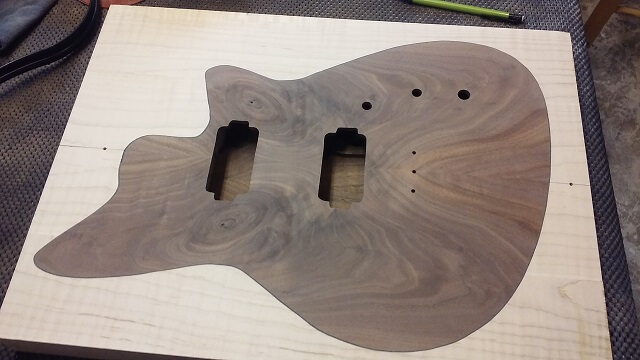 The front sanded flush with the maple frame.