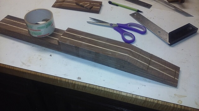 Taping the pieces together in preparation for the scarf joint.