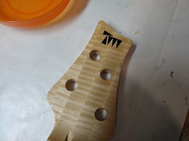 Adding my logo to the headstock.
