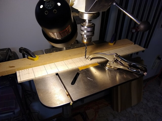 Drilling the holes for the dot inlays.
