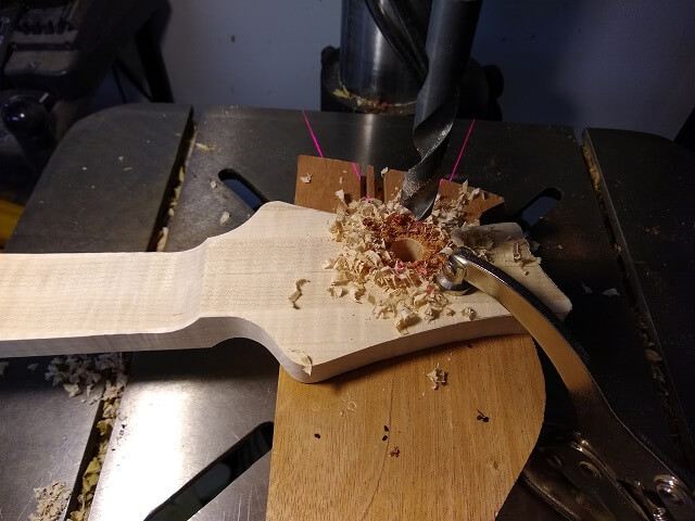 Drilling the tuner holes.