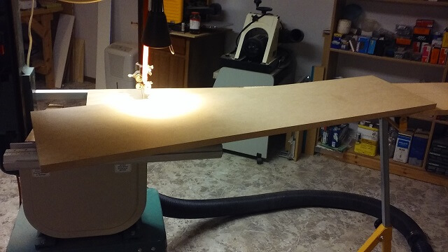 Cutting the curve on the snare bed jig.