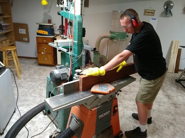 Jointing one side of the Padauk board straight.
