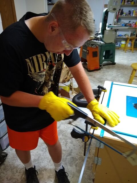 Cutting the carbon fiber rod in half.