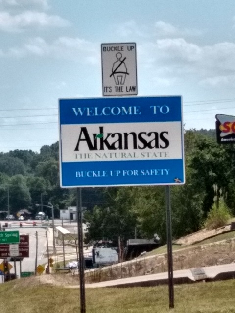 A close up of the Welcome to Arkansas sign.