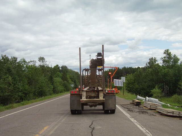 Behind a logging truck on Highway 1.