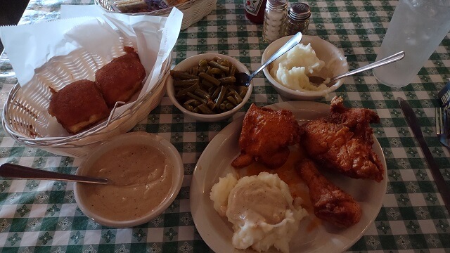 My meal at Stroud's, which included spicy fried chicken, mashed potatoes, gravy, green beans and cinnamon rolls.
