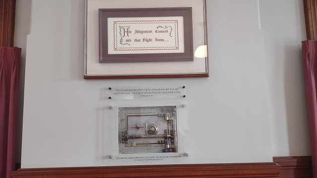 The needlepoint plaque and wall safe from the Shawshank Redemption movie.