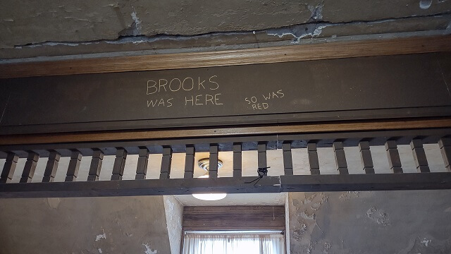 The carving that Brooks and Red made in the beam from the Shawshank Redemption movie.