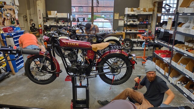 Technicians assembling new Janus motorcycles.