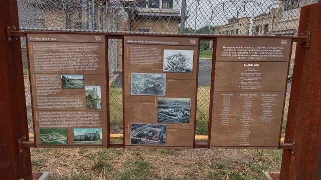 An information board about the Old Joliet Prison in Joliet, IL.