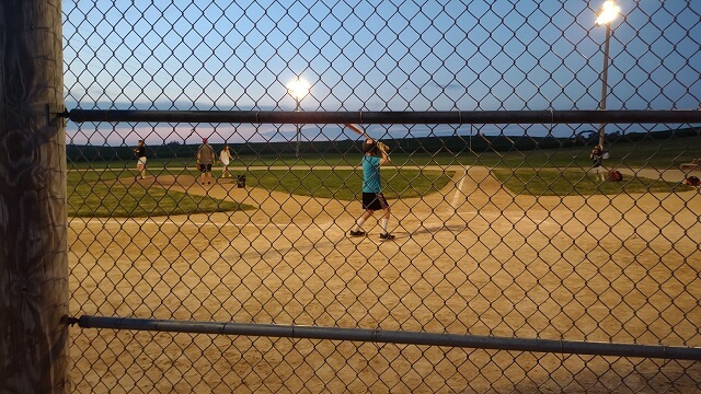 Watching a group play baseball at the Field of Dreams movie site in Dyersville, IA.