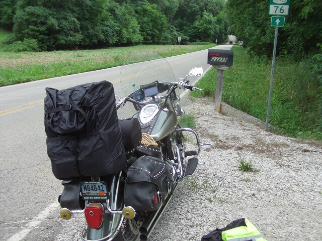 Stopping to put on rain gear on Highway P near Ozora, MO.