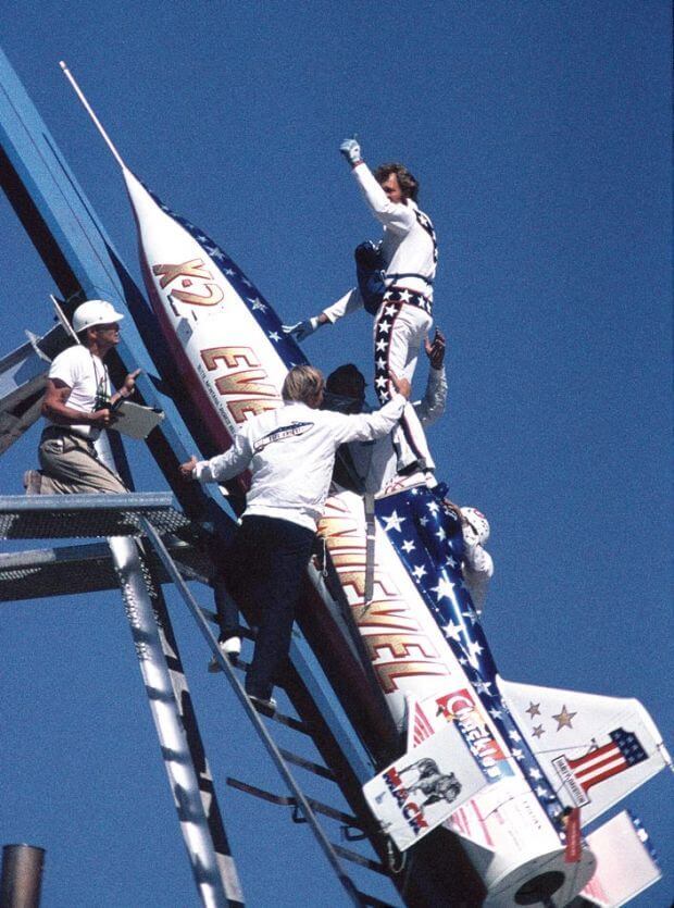 Evel Knievel giving a thumbs-up as he gets into the Skycycle.