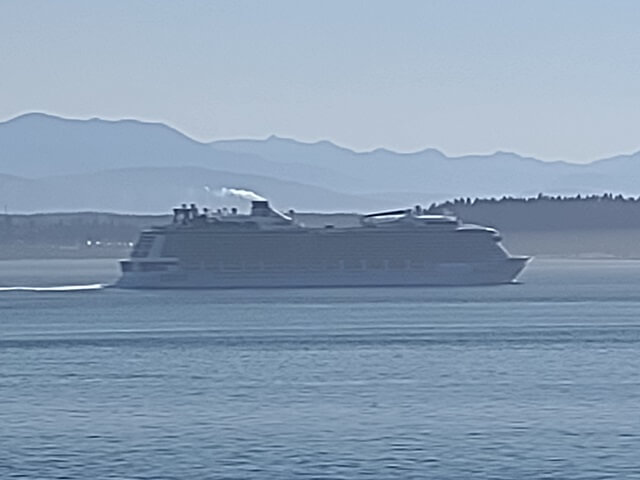 A cruise ship heading out to sea.