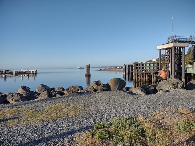 The ferry boat approaching in the distance.