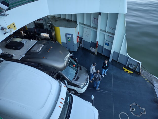 Looking down at the cars on the ferry.