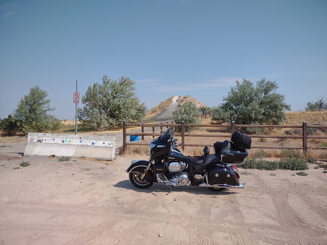 My motorcycle parked in front of the Evel Knievel jump ramp near Twin Falls, ID.